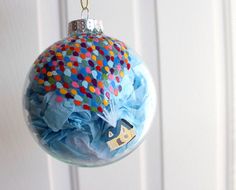 a blue ornament hanging from a white door