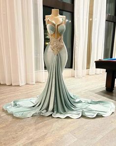 Step into elegance with our stunning Aqua Enchantment Gown. This spectacular dress exudes sophistication with its unique mermaid silhouette that hugs your curves perfectly, creating an alluring and elegant look. The bodice is adorned with delicate lace appliqués, enhancing the dress's luxurious appeal, while the sweetheart neckline adds a touch of romance and grace.Crafted from premium quality fabrics, this gown offers both comfort and style. The intricate detailing and the exquisite aqua hue ma Wedding Swimwear, Crystal Prom Dress, Dresses Art, Engagement Gowns, Evening Dresses Plus Size, Sparkle Dress, Mermaid Silhouette, Mermaid Evening Dresses, Art Dress