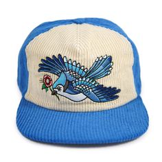 This hat is a tribute to one of the prettiest birds around — and the two-tone color scheme is a nod to the retro sports caps of our adolescence. A traditional tattoo-style blue jay is embroidered on our two-tone cream and blue corduroy hat. Drawn in-house by Stuntin. The cap has an inside circumference of roughly 23-23.5 inches, and features an unstructured front and snapback closure for a perfect fit. Check out our Oriole, Tiger and Cardinal two-tone corduroy hat as well! Corduroy Hat, Retro Sports, Blue Corduroy, Sports Caps, Pretty Birds, Blue Jay, Fit Check, Tattoo Style, Blue Cream