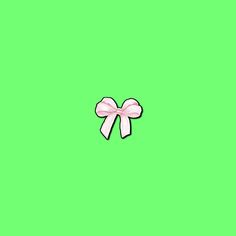 a pink bow on a green background