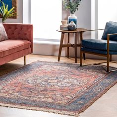 a living room with two couches and a rug