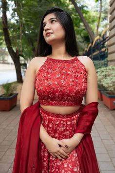 Red attached cancan lehenga with all over floral print. Paired with a padded blouse with placed hand embroidery and dupatta with mirror work hand embroidery. - Aza Fashions Red Georgette Lehenga With Unstitched Blouse, Designer Wear Red Set With Unstitched Blouse, Traditional Sleeveless Gown For Navratri, Red Floor-length Sharara With Unstitched Blouse, Red Georgette Lehenga With Cutdana, Red Semi-stitched Lehenga With Unstitched Blouse, Designer Red Anarkali Set With Unstitched Blouse, Red Floor-length Lehenga With Unstitched Blouse, Red Sharara With Unstitched Blouse For Festive Occasions