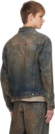 Non-stretch denim jacket. Fading and smudging throughout. · Spread collar · Button closure · Patch pocket and welt pockets · Single-button barrel cuffs · Adjustable button tabs at back hem · Unlined Supplier color: Mud faded indigo Faded Washed Button-up Outerwear, Rugged Washed Denim Jacket, Rugged Medium Wash Denim Jacket With Pockets, Rugged Denim Jacket With Pockets In Medium Wash, Faded Denim Jacket For Streetwear With Button Closure, Faded Denim Jacket With Button Closure For Streetwear, Faded Button Closure Outerwear For Fall, Classic Washed Outerwear With Vintage Look, Classic Faded Washed Outerwear