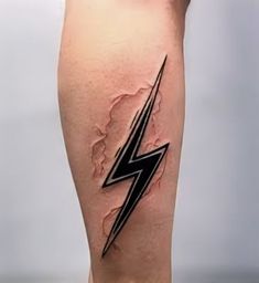 a man's leg with a lightning tattoo on it