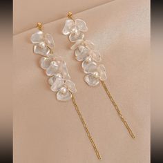 This Unique Pair Is A Wonderful Addition To Your Wardrobe And Your Style; Sure To Get Lots Of Compliments! Gsunuq50b0006a3 Chic White Flower Earrings For Wedding, Chic White Flower Wedding Earrings, Elegant Flower-shaped Beach Earrings, White Dangle Tassel Earrings For Party, White Tassel Earrings For Party, Elegant Dangle Flower Earrings For Beach, Elegant White Flower Earrings For Beach, White Dangle Flower Earrings For Party, Elegant Gold Tassel Earrings For Beach