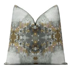 a gray and gold pillow on a white background