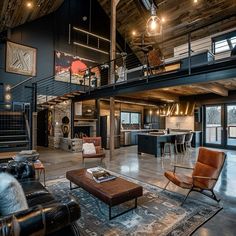 a living room filled with furniture and a spiral staircase leading up to the second floor