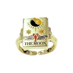 a gold ring with the moon and sun on it's center, sitting in front of a white background