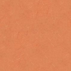 an orange colored paper textured with small scratches