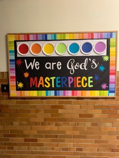 there is a sign that says we are god's masterpiece on the brick wall