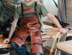 "Split Leg Leather Apron Personalized Leather Apron Blacksmith Woodworking Welding Carpentry Barista Barber Grilling Tattooist Mechanic Work Want to see more leather aprons ? Please click on https://www.etsy.com/shop/FashionRacing?section_id=21524124 Unique universal handmade split leg leather apron for Men's / Women's by Fashion Racing ✂️ Free engraving 🎁 The rugged leather shop apron, made from a single piece of high quality leather. Great style with tough, trustworthy longevity. This apron f Split Leg Apron, Leather Suspenders Men, Butcher Apron, Barista Apron, Work Apron, Shop Apron, Handmade Aprons, Grill Apron, Leather Suspenders