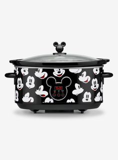 the mickey mouse slow cooker has been painted black and white with red ears on it