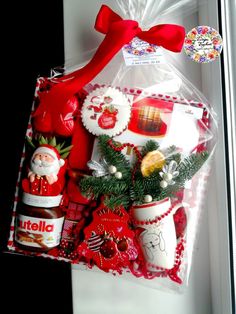 a christmas gift basket with cookies, jams and candies