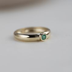 Chunky Emerald Ring 14K Gold - Dome Natural Gemstone Ring Solid Gold Wide - Anniversary Gift D E T A I L S ● Metal: 14K solid gold, 14K white gold ● Gemstone: Natural Emerald 3mm ● Emerald's Weight: 0.12ct R I N G ∙ S I Z I N G For General Reference: ● we use standard US Ring Sizing ● an average women's ring finger is size 6-7 ● each ring is custom-made upon order, in any desired size. ● if your ring size is not listed please contact us H O W ∙ T O ∙ O R D E R Choose from the drop-down menus the Gold Emerald Ring With Tension Setting, Yellow Gold Emerald Ring With Tension Setting As Gift, Promise Emerald Ring In Yellow Gold, Gold Emerald Ring With Tension Setting For Promise, Emerald Bezel Setting Ring For Promise, Formal Emerald Ring With Tension Setting For May Birthstone, Fine Jewelry Emerald Ring With Tension Setting, Polished Emerald Ring For Wedding, Anniversary Emerald Ring With Tension Setting In Yellow Gold