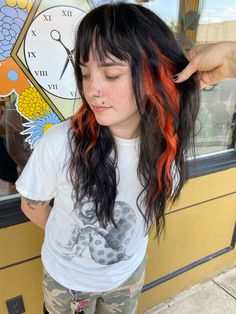 Dark shag haircut with peek-a-boo orange pieces Dark Shag Haircut, Orange Roots Black Hair, Orange Hair Streaks, Fun Dyed Hair, Orange And Red Highlights, Ginger Hair With Dark Roots, Orange And Brown Hair, Black And Orange Hair, Orange And Black Hair