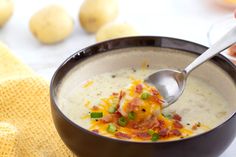 a bowl of potato soup with bacon and cheese