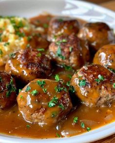 meatballs covered in gravy and garnished with parsley