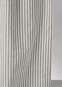 the side view of a black and white striped curtain