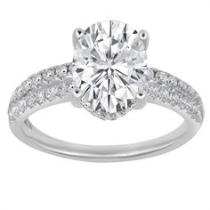 a white gold engagement ring with diamonds on it