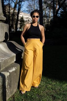 Introducing our latest addition: the "Palazzo" Pants. Crafted in-house, our team takes great pride in manufacturing each item, echoing Alan Watts' wisdom that "the only way to make sense out of change is to plunge into it, move with it, and join the dance." These pants blend comfort and style seamlessly. The lightweight cotton fabric drapes elegantly, perfect for spring days. With a wide-leg silhouette, they exude sophistication. Tailored to perfection through our "made to order" service, they o Yellow Wide Leg Bottoms With Side Pockets, Yellow Wide Leg Pants With Side Pockets, Summer Yellow Pants With Side Pockets, Yellow Summer Pants With Side Pockets, Yellow Pants With Side Pockets, Fitted Yellow Wide Leg Pants With Pockets, Yellow Full-length Pants With Elastic Waistband, Yellow Full Length Pants With Pockets, Draped Fabric