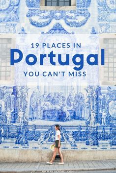 a woman walking past a blue and white wall with the words 19 places in portugal you can't miss