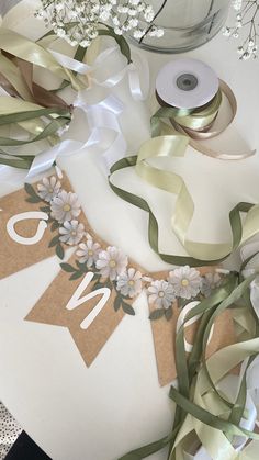 some ribbons and flowers on a table