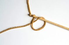 a piece of rope with a wooden handle