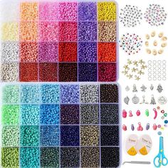 many different colors of beads and accessories in a plastic container with scissors, clippers, pins