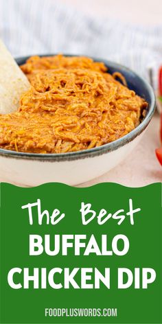 the best buffalo chicken dip recipe in a bowl with tortilla chips and tomatoes