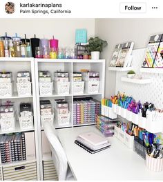 a white desk with lots of craft supplies on top of it and an instagramr above the desk