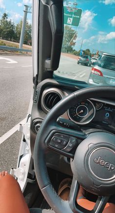 the steering wheel and dashboard of a vehicle