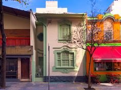 an image of a street scene with buildings painted in different colors