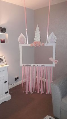 a room decorated with pink and white decorations