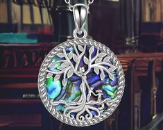 Tree of Life Abalone Shell Pendant Necklace Design Mother's Day Tree Of Life Round Necklace, Mother's Day Tree Of Life Necklace, Tree Of Life Round Pendant Necklace For Mother's Day, Tree Of Life Pendant Necklace For Healing, Tree Of Life Necklace Silver, Unique Tree Of Life Round Pendant Necklace, Unique Sterling Silver Tree Of Life Necklace, Nature-inspired Tree Of Life Pendant Necklace, Silver Tree