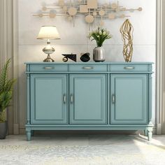 a blue cabinet sitting in front of a white wall