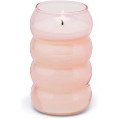 a pink candle holder sitting on top of a white table