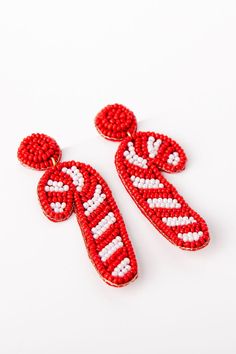 Detail Candy Cane Earrings Patterns may vary Man made materials Colors may vary from different viewing devices. Candy Cane Earrings, Cocktail Dress Wedding Guest, Holiday Party Fashion, Wedding Guest Style, Red Romper, Pink Rompers, Halloween News, Christmas Gift Guide, Pink Lily