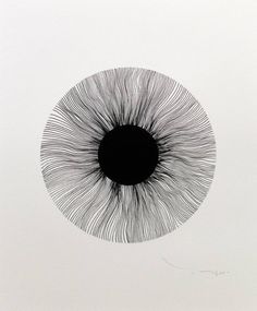 an eyeball is shown in the middle of a white paper with black lines on it