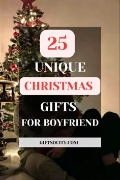 two people sitting in front of a christmas tree with the words 25 unique christmas gifts for boyfriend