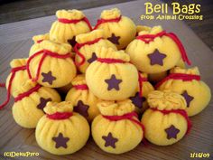 a pile of yellow pumpkins sitting on top of a wooden table