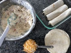 tortillas, cheese and other ingredients are being prepared in pans on the counter