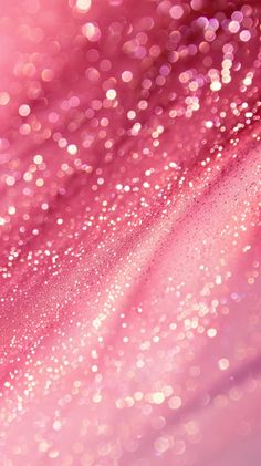 an abstract pink background with small white dots