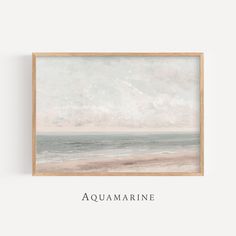 an ocean scene with the words aquamarinee in black and white, framed on a wall