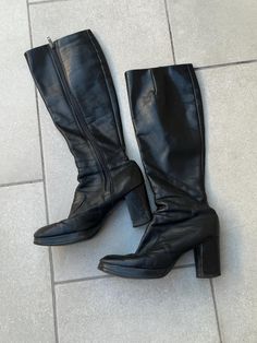 Vintage 70s Black Leather Platform Gogo Boots with Side Zip. Women's Size 6. Metal side zipper on inner side of boots. They are just below knee high length with shaft measuring 15" from top of boot to the top of the heel and 18" total length from top to bottom of boot. 3" wide measurement taken from bottom of sole. Soles look to be in excellent condition. Chunky 3" heel with .75" platform toe. Round toe shape. There are obvious signs of previous wear and age: surface scuffs and wear and a few he Vintage Black Heeled Boots For Winter, Retro Fitted Black Heeled Boots, Retro Knee-high Platform Boots For Fall, Retro Wide Calf Knee-high Boots, Retro Knee-high Fall Boots, Retro Knee-high Boots For Fall, Retro Wide Calf Boots For Fall, Vintage Knee-high Heeled Boots For Winter, Vintage Black Knee-high Boots For Fall