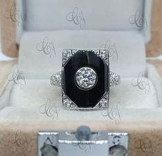 1.80 Carat Vintage Art Deco Style Round Cut Antique Engagement Ring In 925 Sterling Silver For Women Onyx Diamond Ring Antique Style Ring Main Stone Shape: Round Main Stone Weight: 1.80CT Main Stone Colour: White Main Stone Type: Cubic Zirconia Primary Stone Shape: Round Primary Stone Colour: White Primary Stone Type: Cubic Zirconia Metal : Sterling Silver Metal Purity : 925 Please contact us for Different Metal Color & Purity. ✱ ETSY SHOP : https://www.etsy.com/in-en/shop/CreativeByChirag ✱ Antique Style Rings, Estate Rings, Antique Diamond Rings, Antique Engagement, Antique Engagement Rings, Round Cut Diamond, Antique Style, Vintage Art Deco, Art Deco Fashion