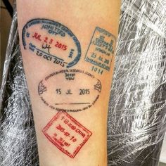 a person with a passport tattoo on their arm