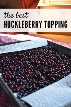 the best huckleberry topping is in a pan on top of a red rug