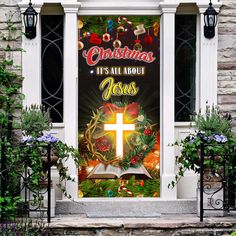 a window decorated with an image of the cross and christmas decorations