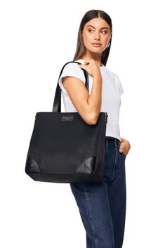 The Alfie by Nakedvice is a unisex tote bag crafted from smooth black nylon and vegan leather. Featuring two large top handles and a removable branded strap that allow you to carry The Alfie on your shoulder or wear as a crossbody bag. Large enough to stow a laptop, The Alfie sports a spacious interior with internal pockets to keep you organised. The Alfie makes the perfect travel bag. 

 








 Colour: BLACK NYLON Chic Nylon Bags For Workwear, Chic Nylon Bags For Work, Chic Nylon Workwear Bags, Classic Everyday Nylon Shoulder Bag, Classic Nylon Shoulder Bag For Everyday, Nylon Tote Bag For Work, Nylon Shoulder Bag With Removable Pouch For Work, Perfect Travel Bag, Craft Tote Bag