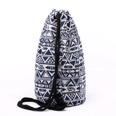 a blue and white bag with black trim on the bottom is sitting in front of a white background